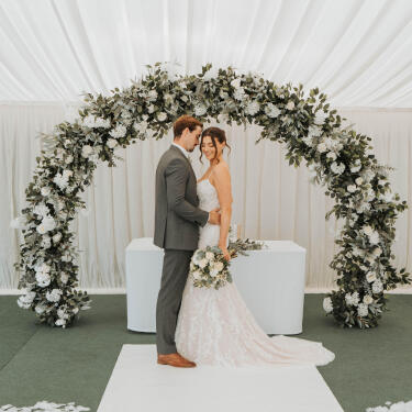 Newlywed couple posing for a photo.