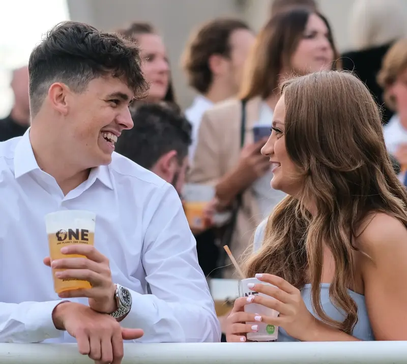 A couple smiling at each other.