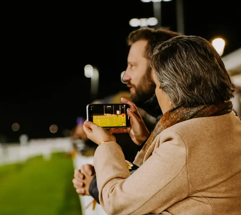 Racegoers watching action at Chelmsford.