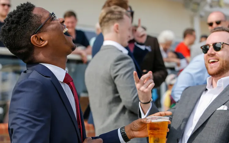 Two smartly dressed gents enjoying a laugh at Chelmsford City Racecourse