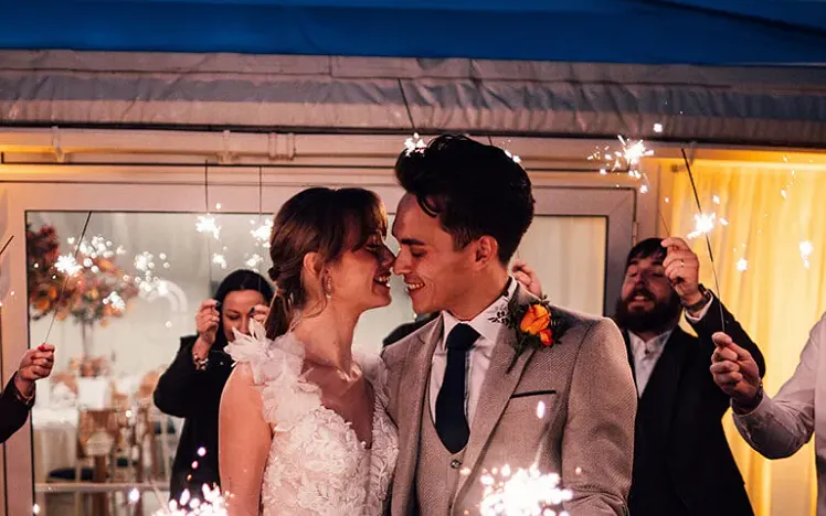 A happy newly wed couple at their wedding venue - Chelmsford City Racecourse