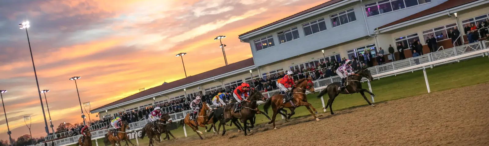 Sunset at Chelmsford Racecourse during a race.