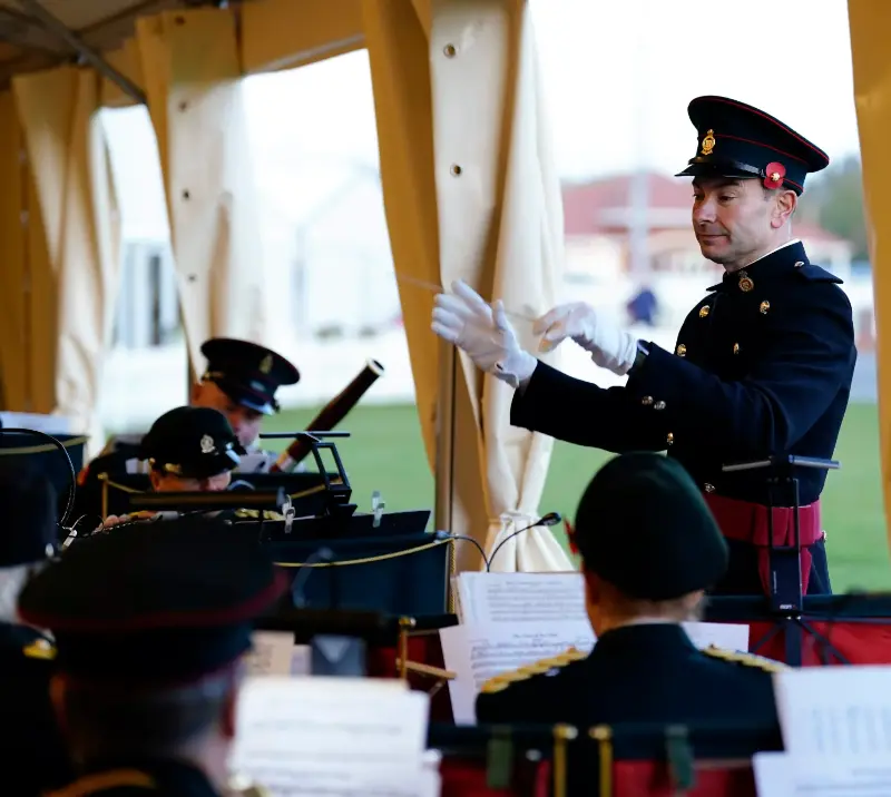 A orchestra band in a marquee.