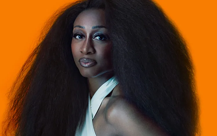 Beverley Knight on an orange background.