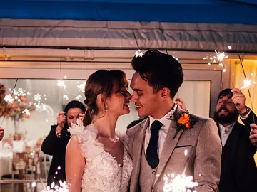 A happy newly wed couple at their wedding venue - Chelmsford City Racecourse