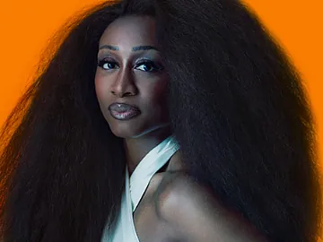 Beverley Knight on an orange background.