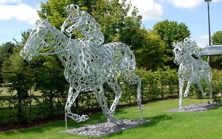 Horse racing sculptures made of metal