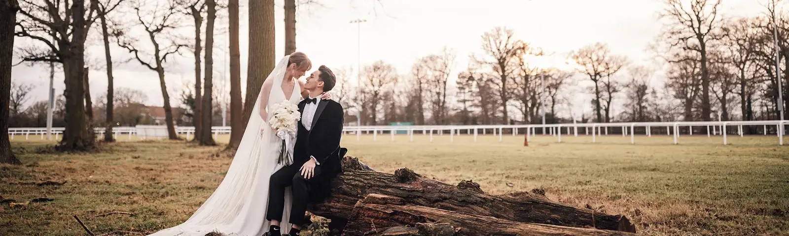 Couple posing for a photo at sunset.